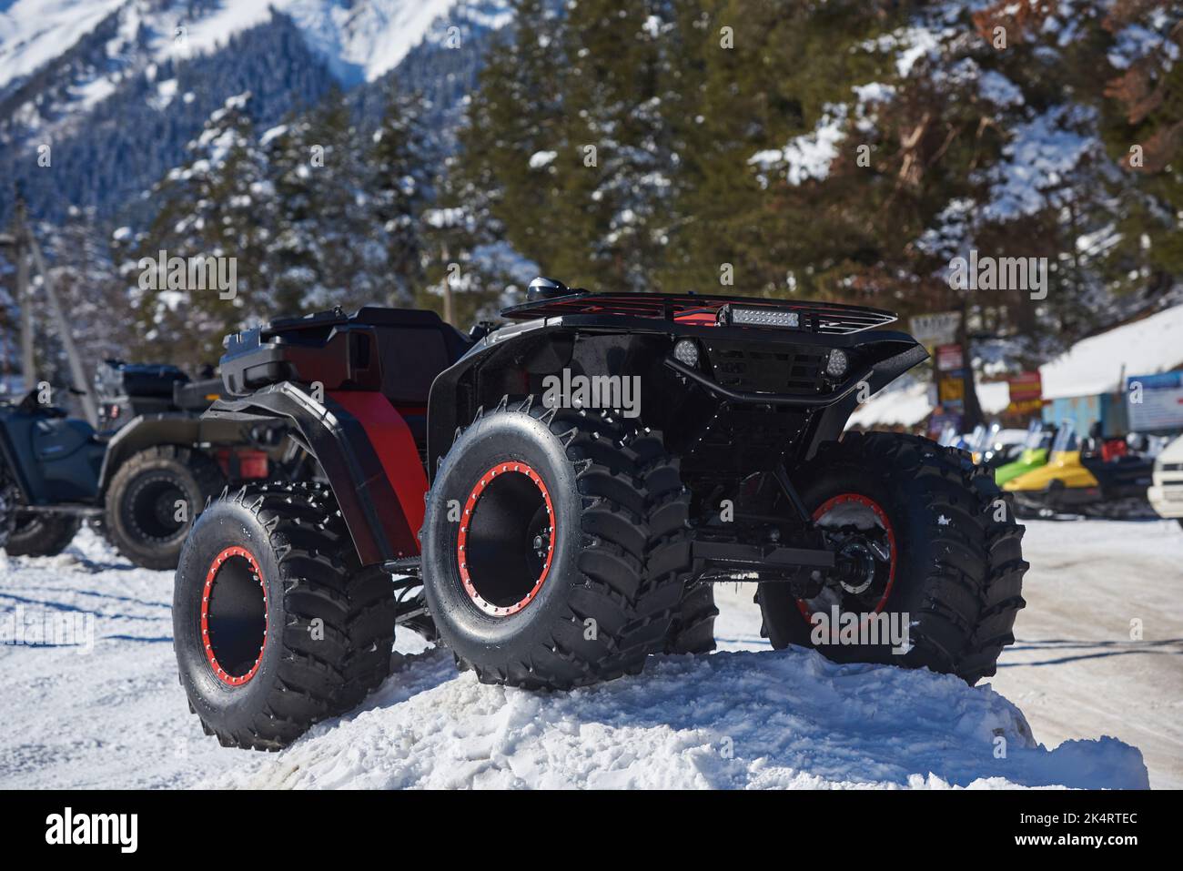Quadbike with big wheels on the snow. Stock Photo