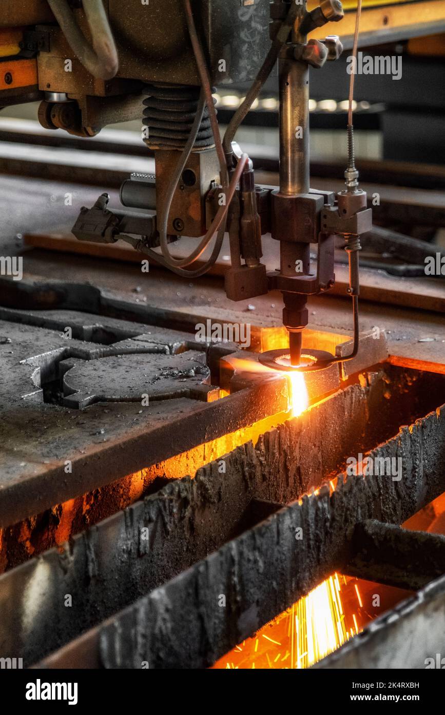 CNC machine cutting the metal plate. The hitechnology sheet metal manufacturing process Stock