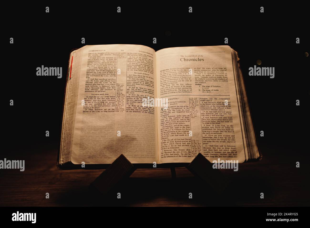 A closeup shot of a historic old Bible open on the Chronicles pages on ...