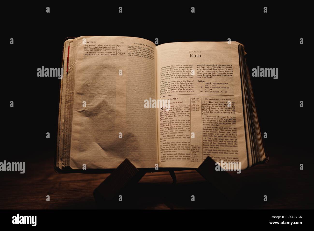 A closeup shot of a historic old Bible open on the Ruth pages on ...