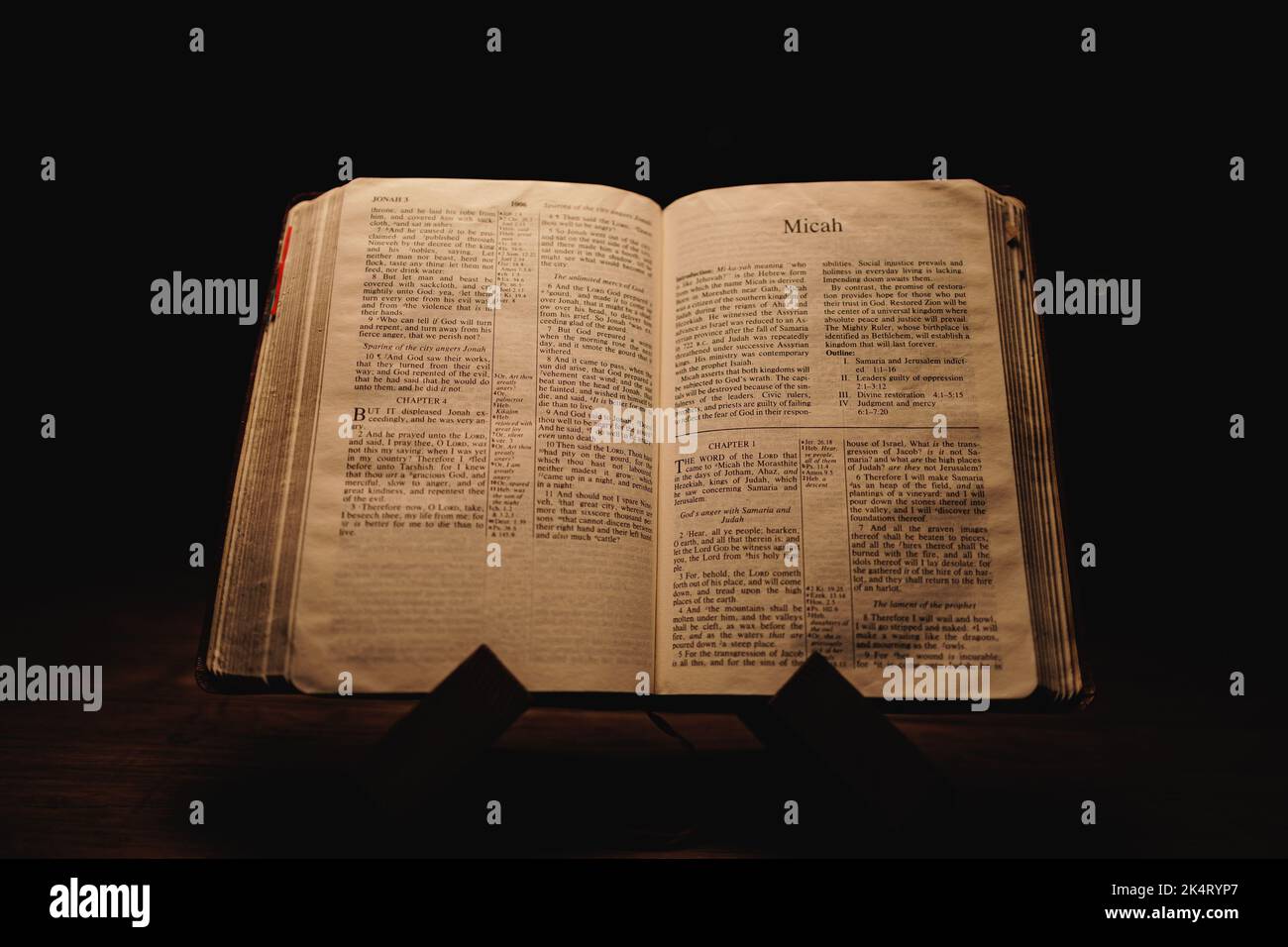 A closeup shot of a historic old Bible open on the Micah pages on ...