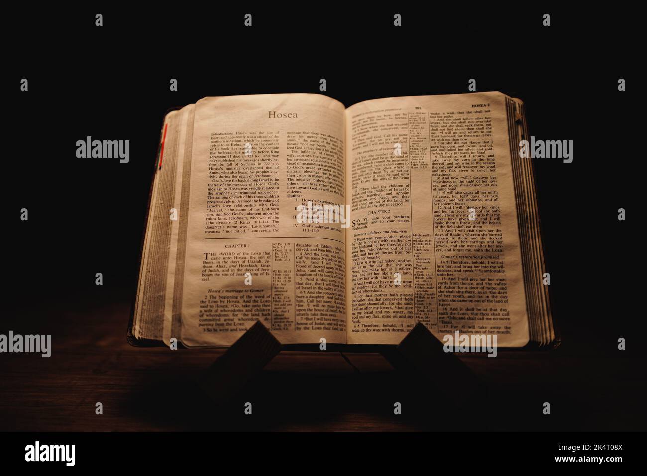 A closeup shot of a historic old Bible open on the Hosea pages on ...