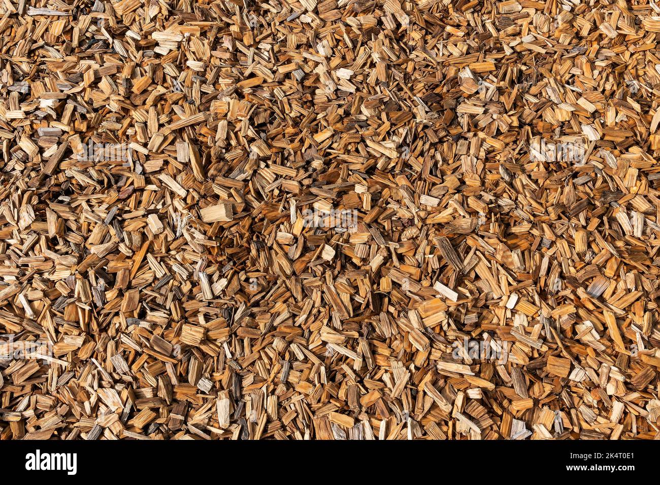Wood chip bark chippings having been shredded for use as a garden mulch