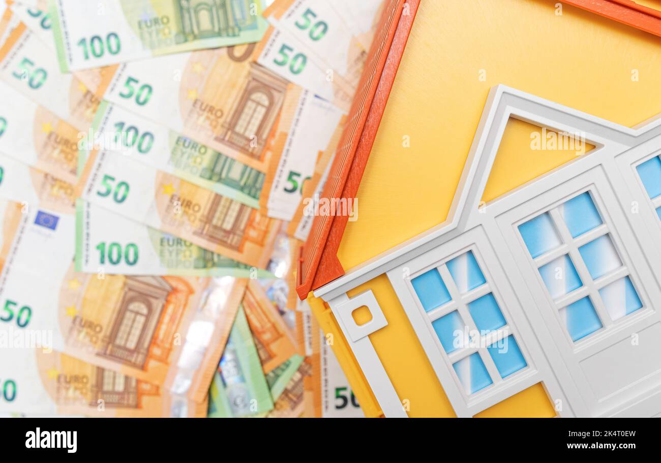 Model of house with banknotes hi-res stock photography and images - Alamy