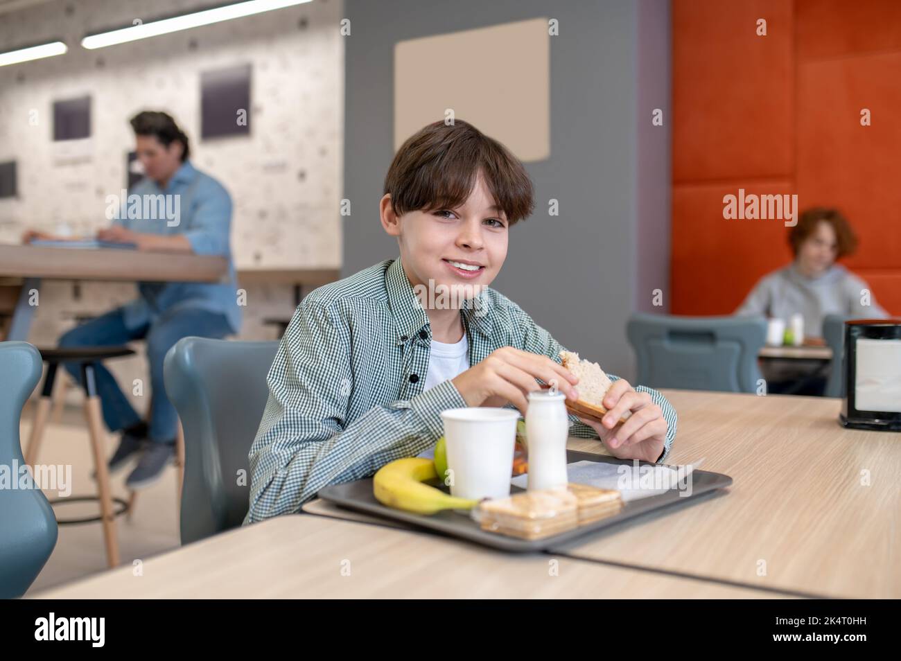 Pupil having lunch in the school canteen Stock Photo