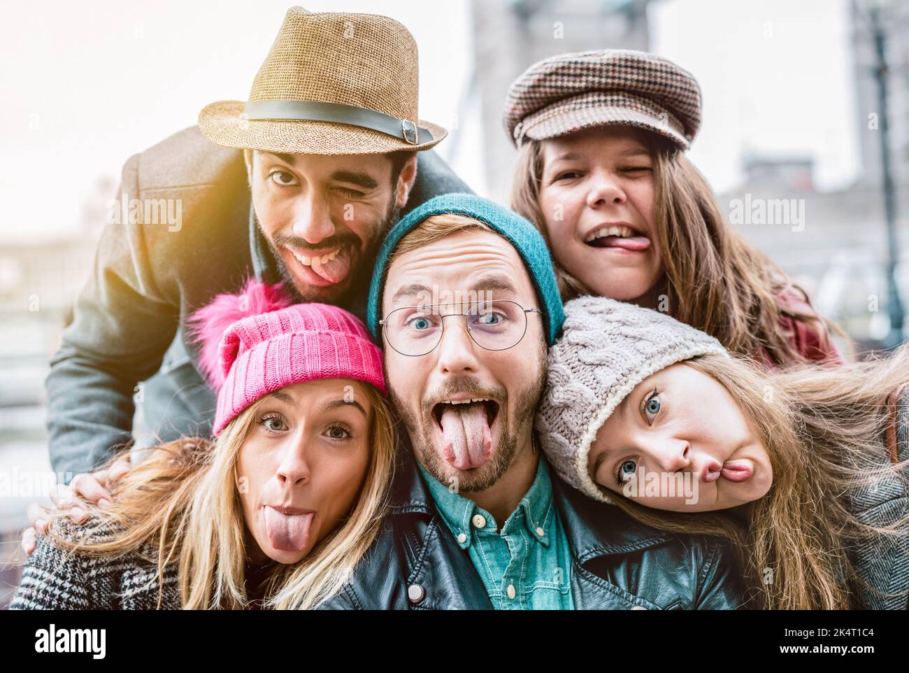 Best friends taking selfie on winter fashion clothes - Happy friendship concept with millennial people having fun together - Everyday life of next gen Stock Photo