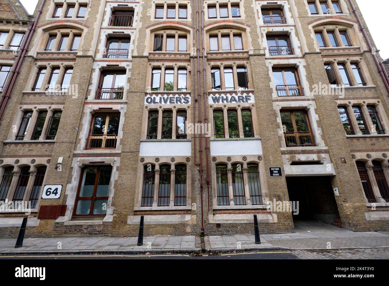 A view of the historic riverside Olivers Wharf in Wapping on 7th September 2022 in London, United Kingdom. Olivers Wharf is a Grade II listed apartment building and former warehouse on the River Thames in Wapping High Street. Stock Photo