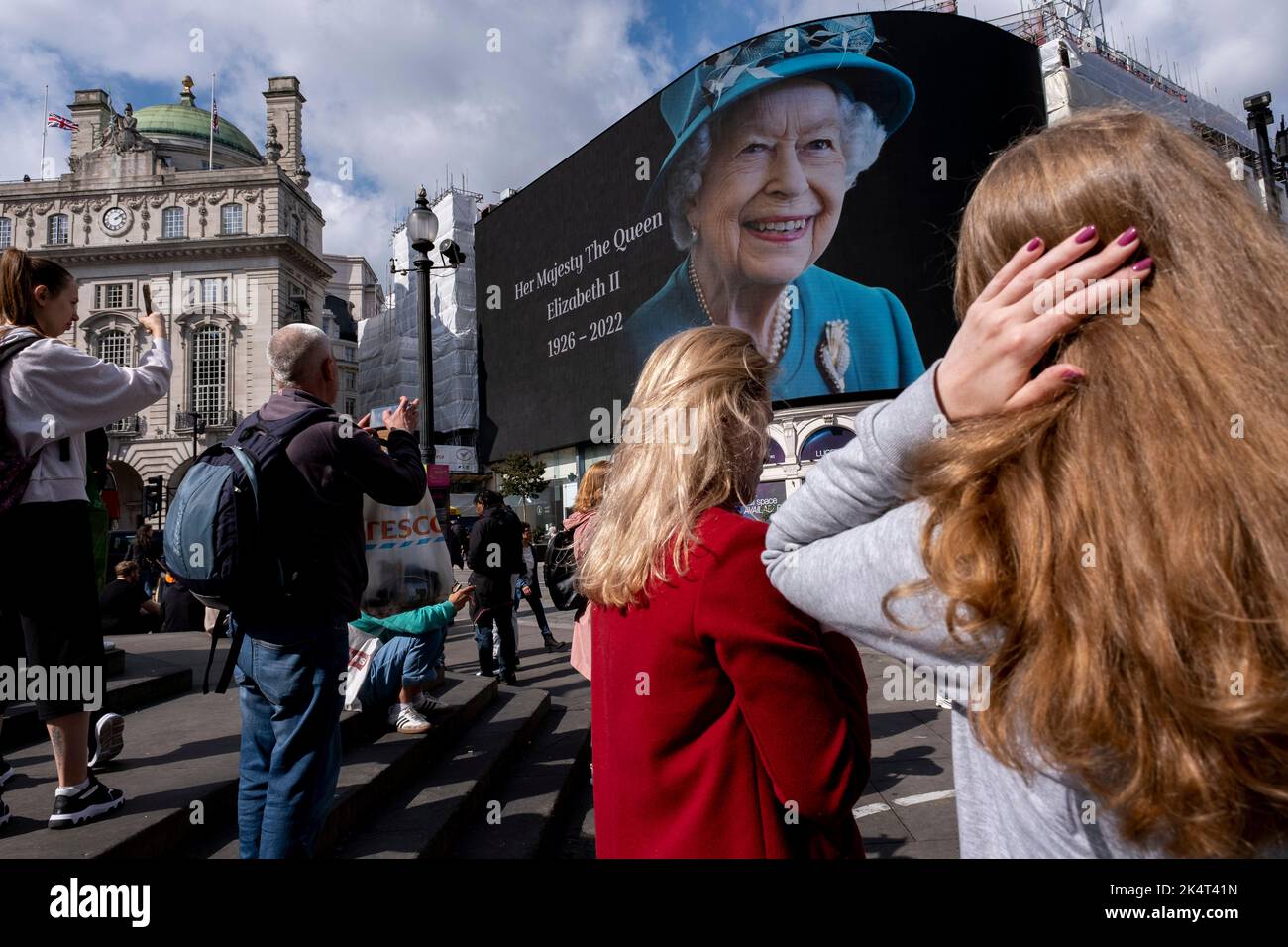 With advertising suspended, visitors and tourists at Piccadilly Circus ...
