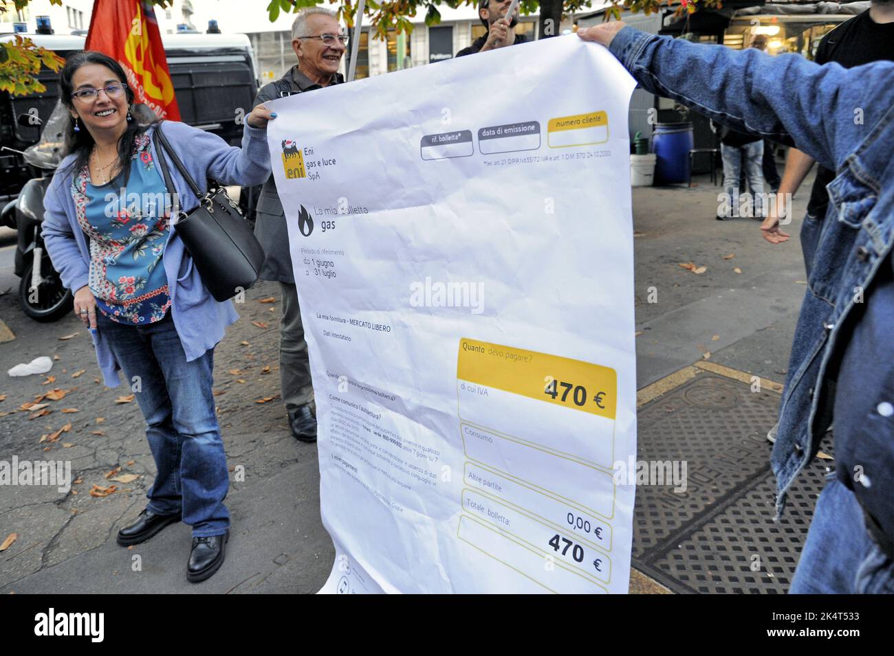 Milan, October 2022, USB base unions protest in front of ENI's city office against rising gas prices due to the international energy crisis and speculation. A facsimile of gas bill is burnt Stock Photo