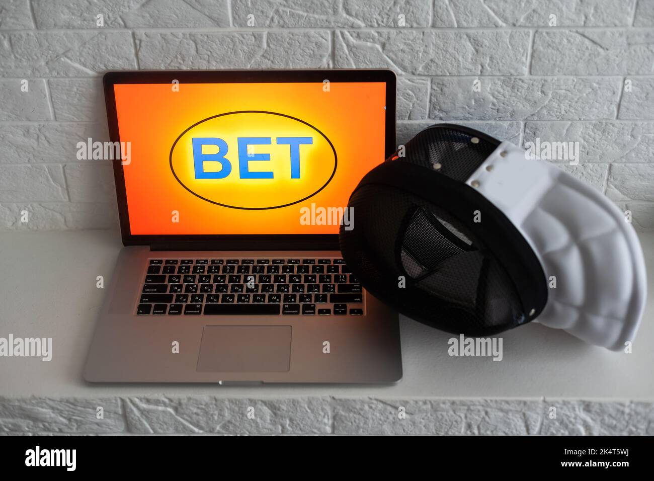 fencing, sports betting on a laptop Stock Photo