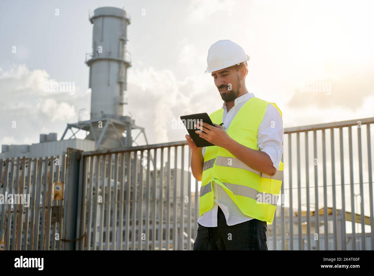 Photo of caucasian man engineer using digital table to do inspections ...