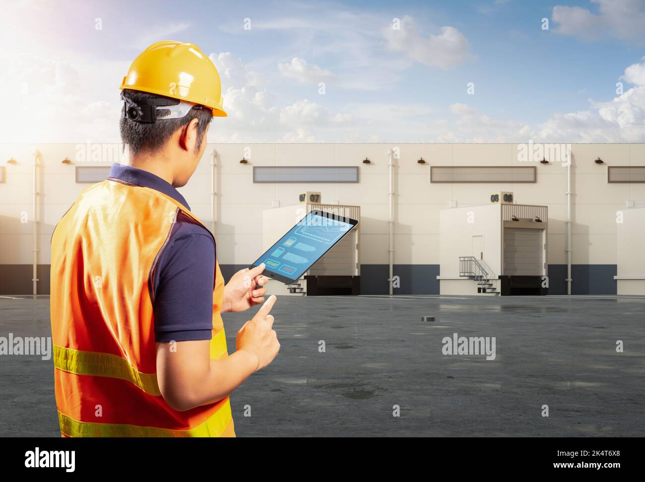 Asian worker or engineer work at warehouse with digital tablet Stock Photo