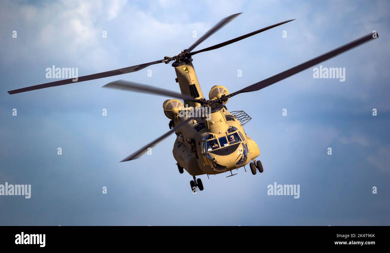 US Army Boeing CH47F Chinook transport helicopter in flight. The