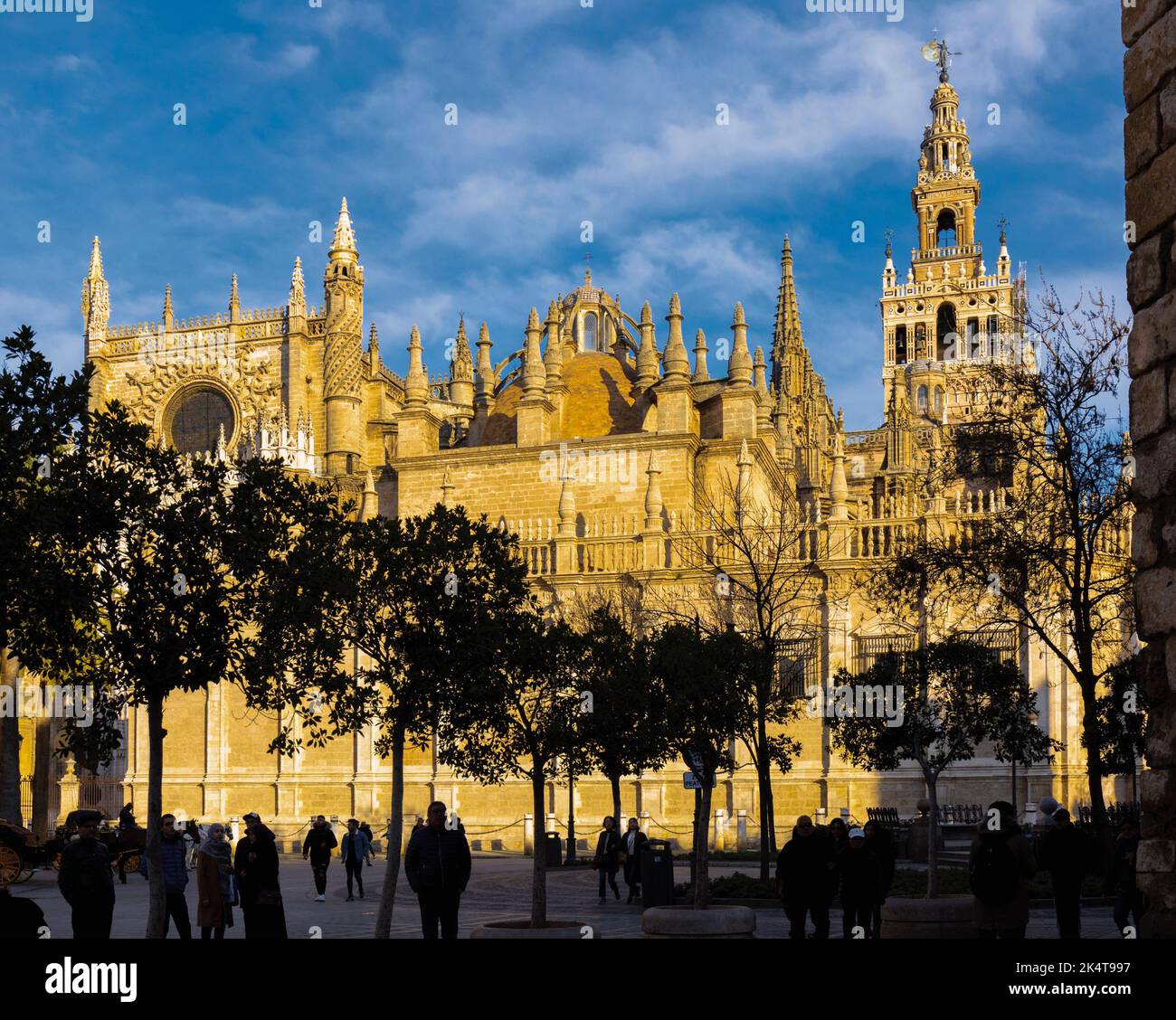 The gothic cathedral, Seville, Seville Province, Andalusia, Spain.  The Giralda tower is on the upper right.  Catedral de Santa María de la Sede/Cathe Stock Photo