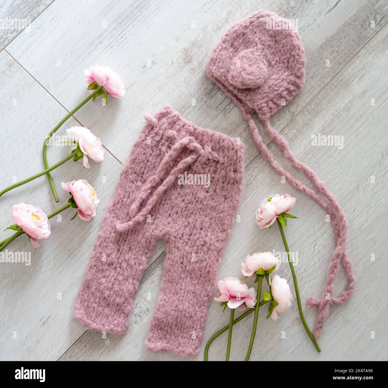 Simple knitted handmade clothes for newborn babies Stock Photo Alamy