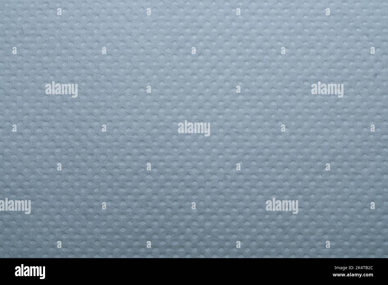 White dotted paper macro. background. napkin surface close up Stock Photo