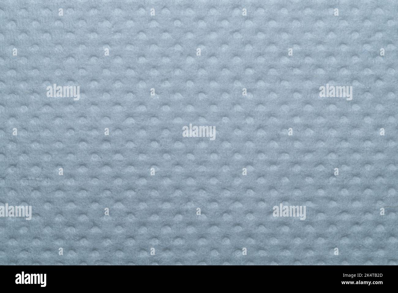 White dotted paper macro. background. napkin surface close up Stock Photo