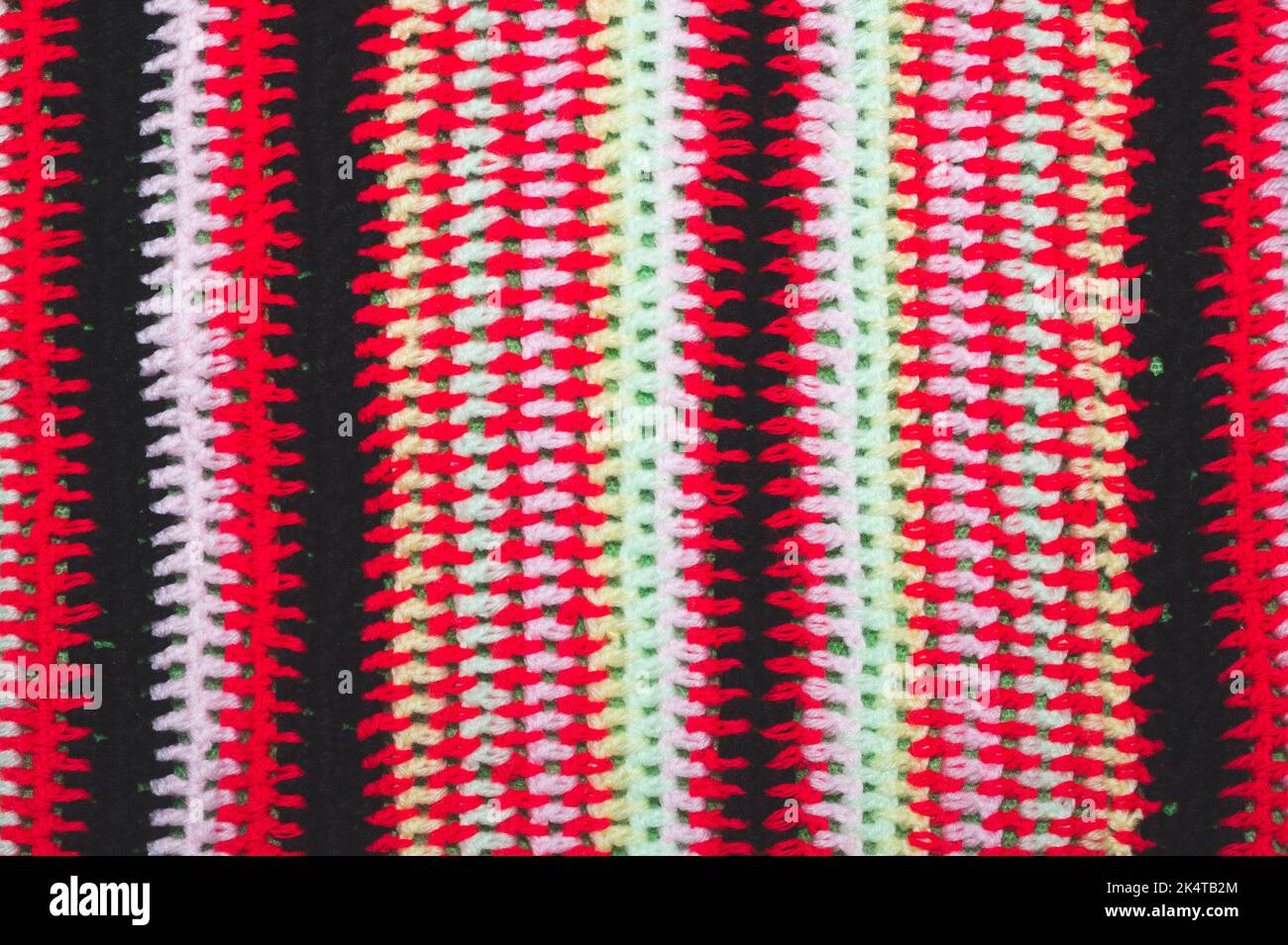 Knitted background from colored threads close up Stock Photo