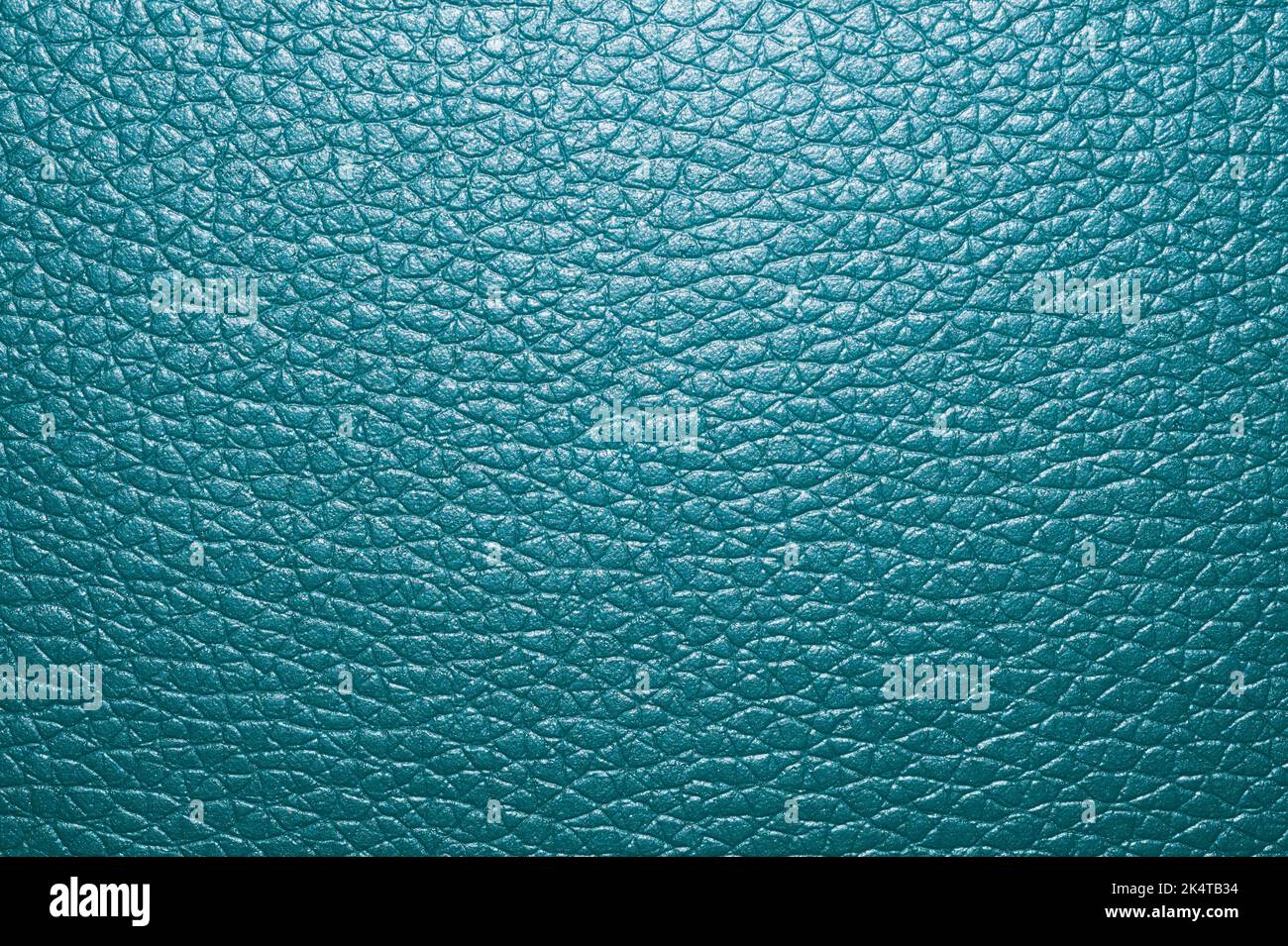Blue colored leather surface background close up Stock Photo