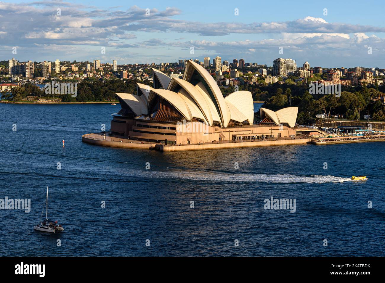 The Sydney Opera House on Bennelong Point on a sunny afternoon Stock Photo