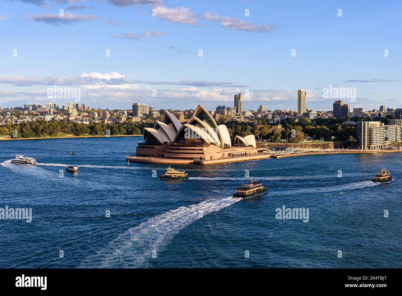 Ferries in front of the Sydney Opera House on Bennelong Point on a sunny afternoon Stock Photo