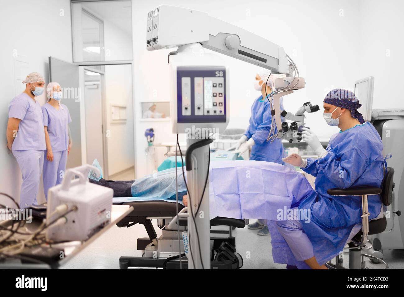 Doctor and his assistants perform the eye operation Stock Photo