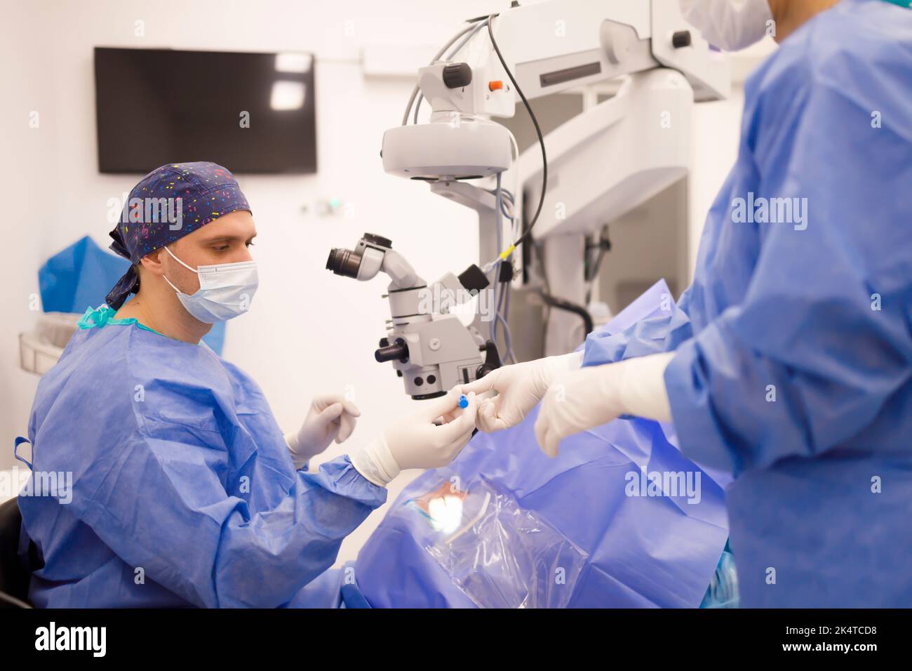 Doctor and an assistant perform a professional operation Stock Photo