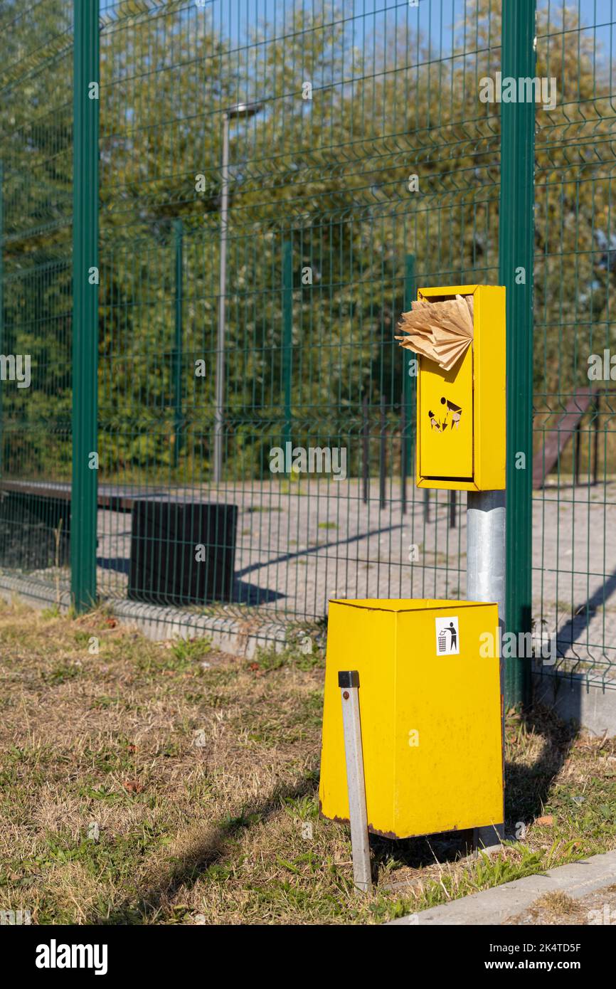 paper bag for excrement at the dog run Stock Photo