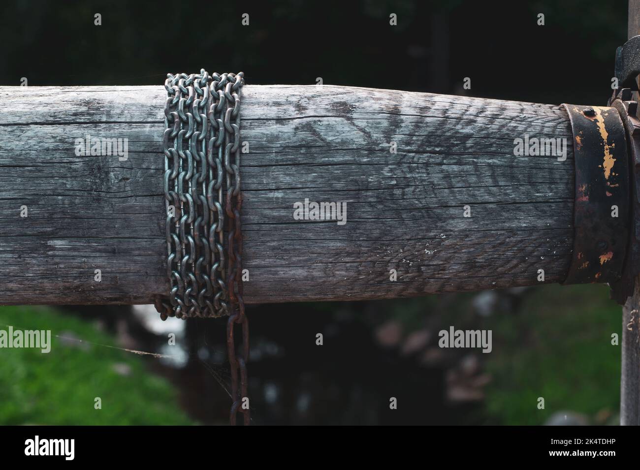 Detail of wooden winch with chain. part of mechanism of water from the