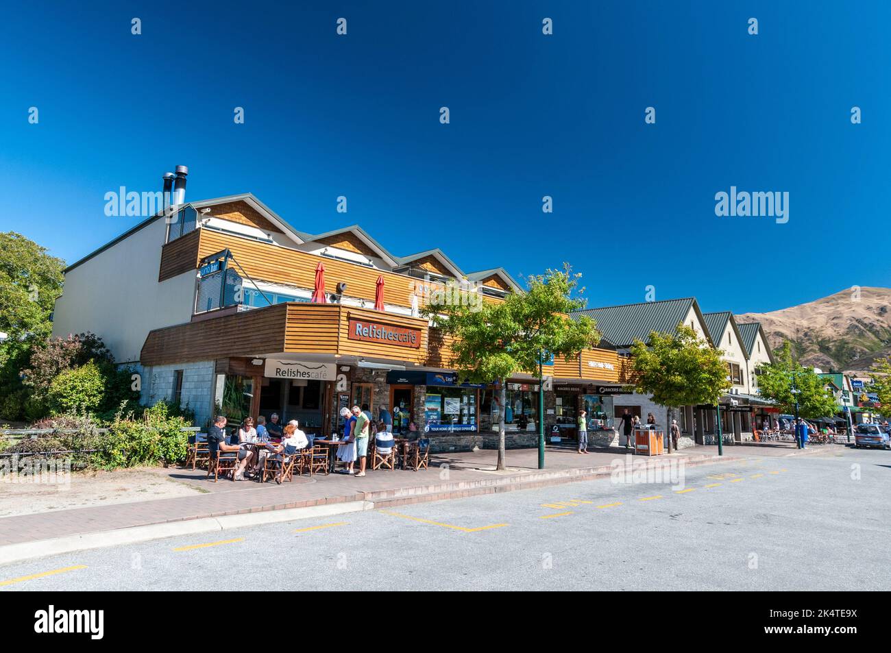 A row of small shops, bistros and eateries on Ardmore Street in Wanaka, a small summer /Winter ski resort town in the Otago region of South Island in Stock Photo