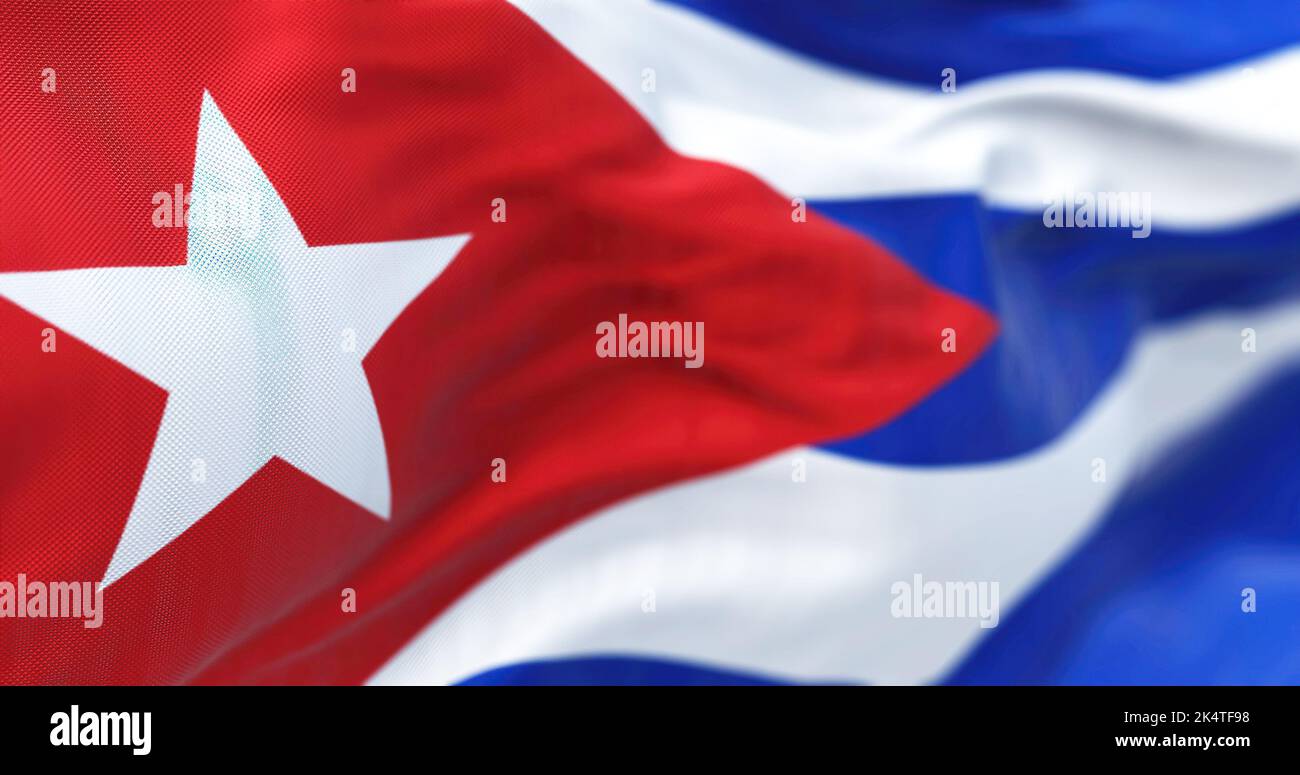 Close-up view of the Cuba national flag waving in the wind. The Republic of Cuba is an island state in Central America. Fabric textured background. Se Stock Photo