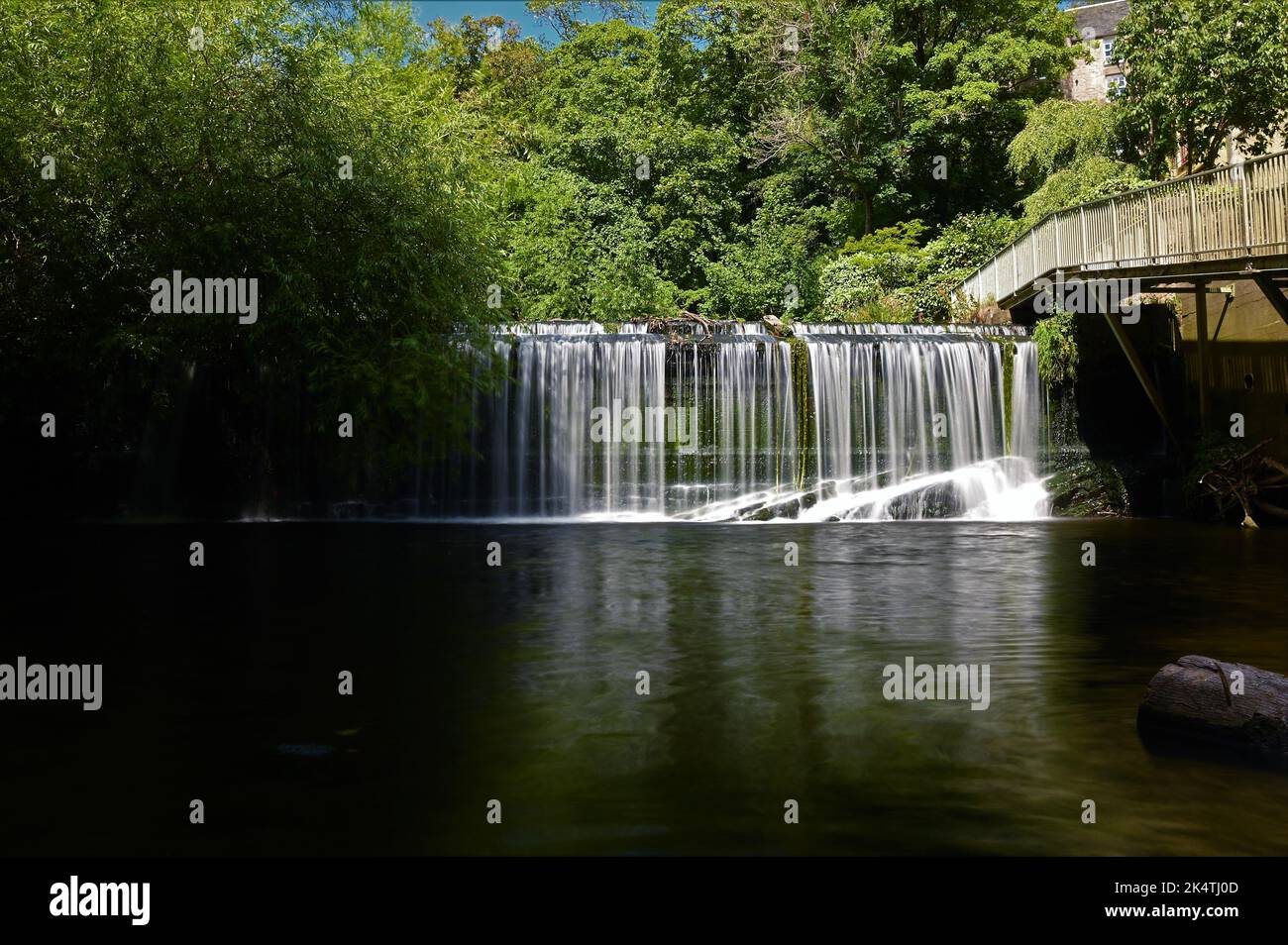 A view of a waterfall on the water of Leith in the city of Edinburgh in