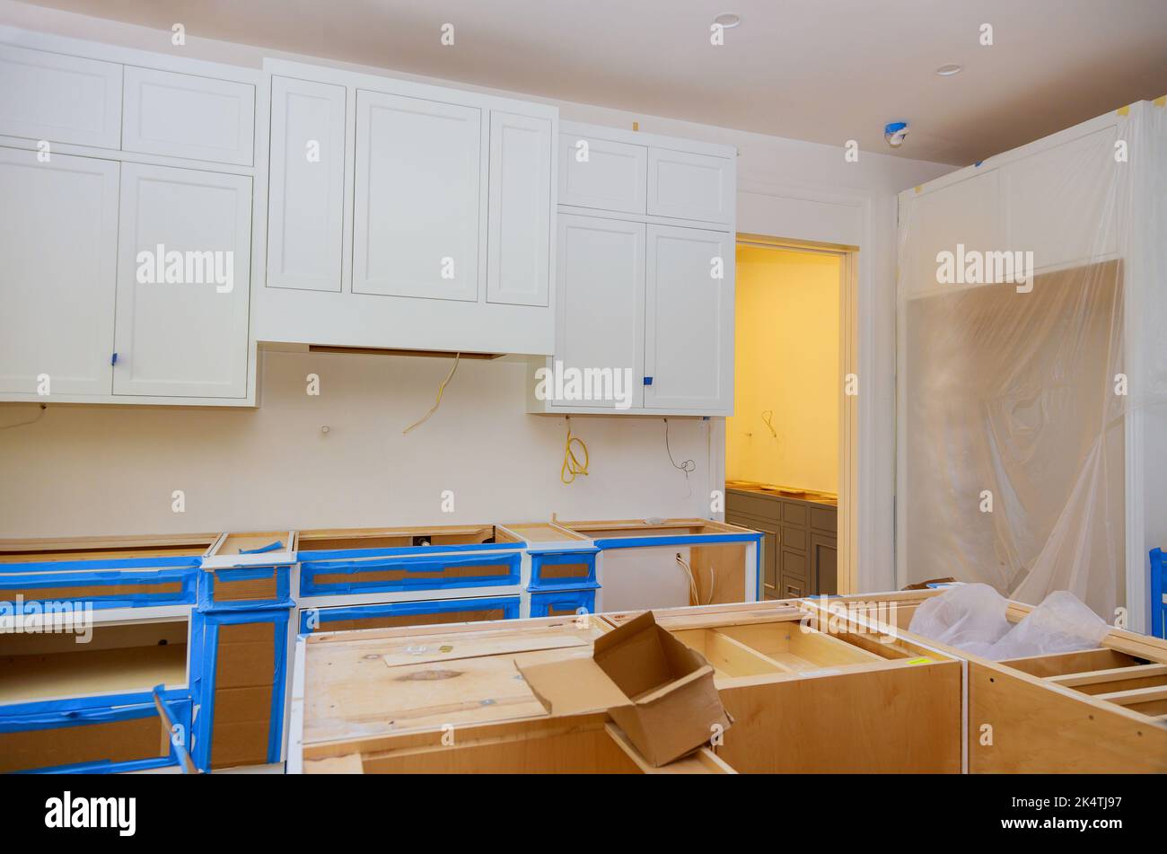 Installation of white kitchen and furniture interior with