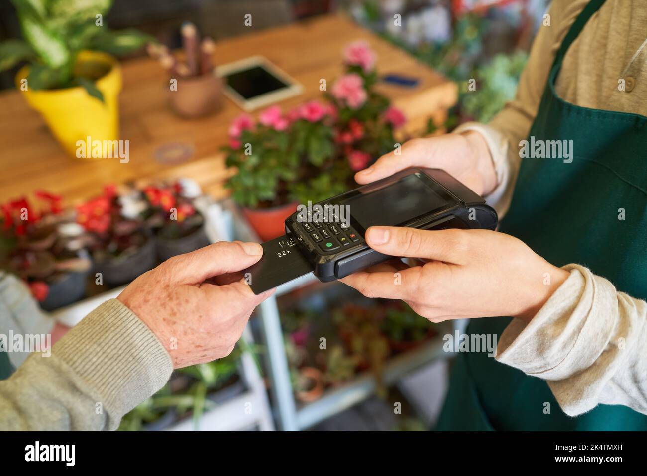 Cashless payment with credit card at the reader at the checkout in retail Stock Photo