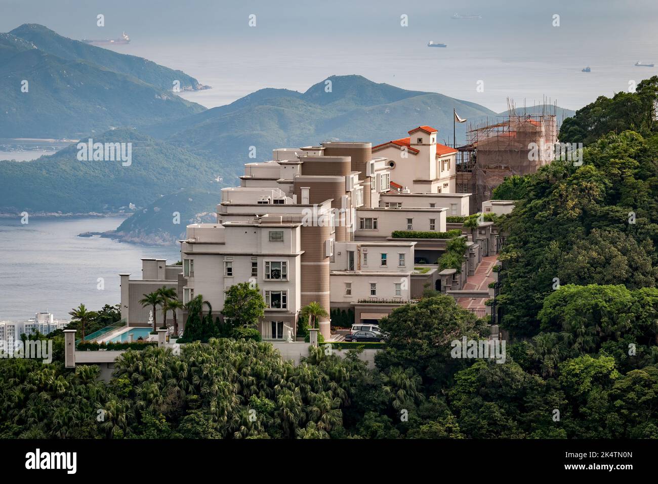 84 Peak Road, with Villa Rosa at rear - luxury houses on The Peak, Hong Kong Island Stock Photo