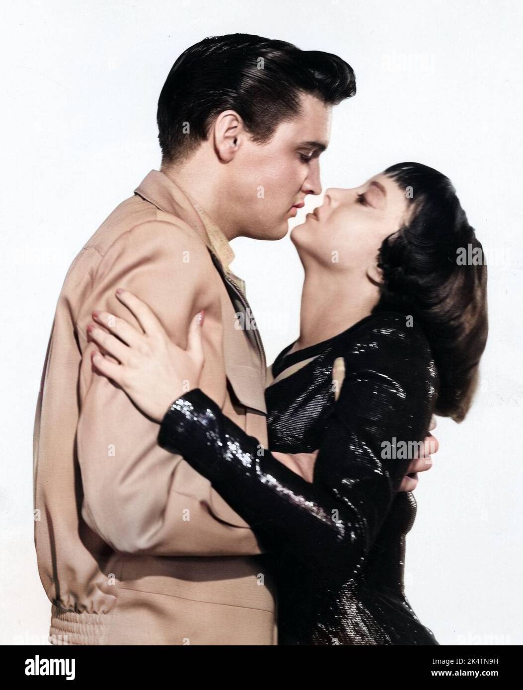 Elvis Presley and Caroline Jones in 'King Creole' (Paramount, 1958) publicity still colorized photo. Stock Photo