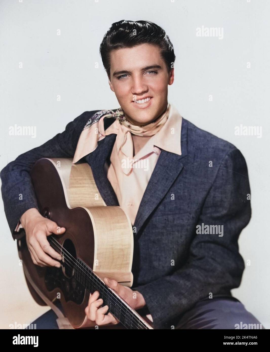 Elvis Presley portrait with a guitar. 'King Creole' (Paramount, 1958). Colorized publicity photo. Stock Photo
