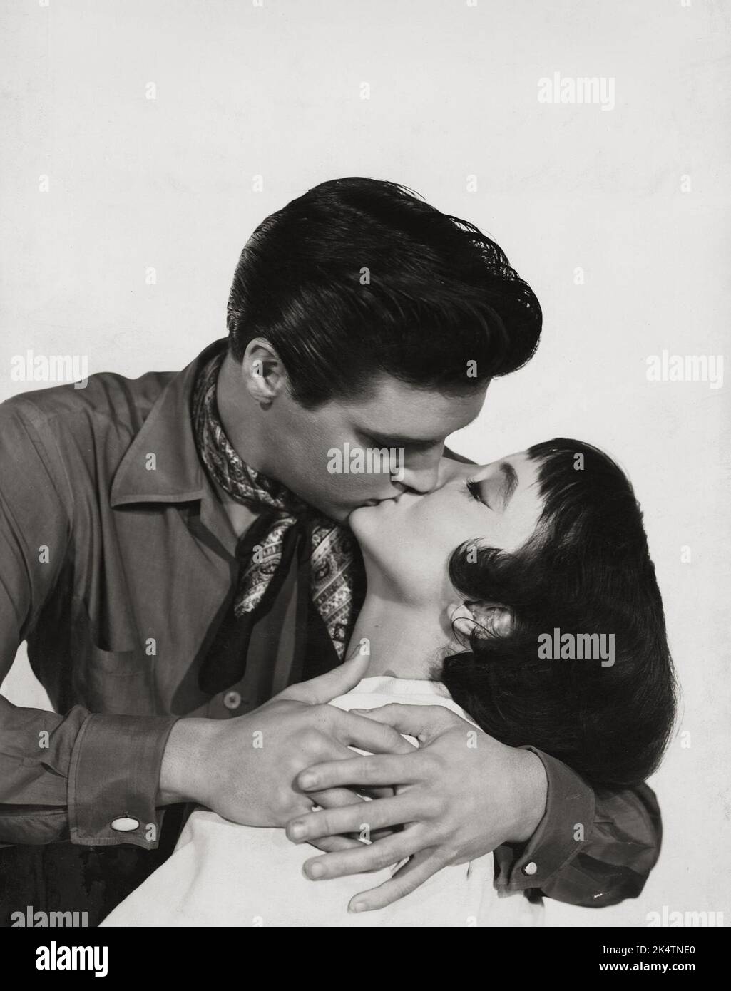 Elvis Presley kissing Caroline Jones. 'King Creole' (Paramount, 1958) publicity photo. Stock Photo