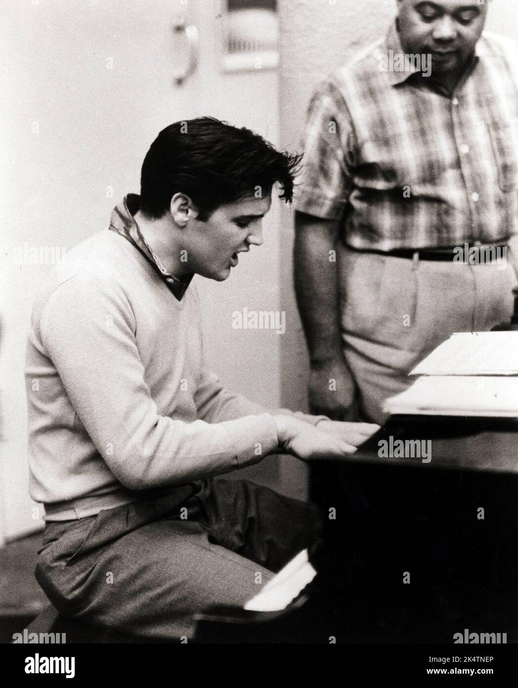 Elvis Presley playing piano in 'King Creole' (Paramount, 1958). Publicity photo. Stock Photo