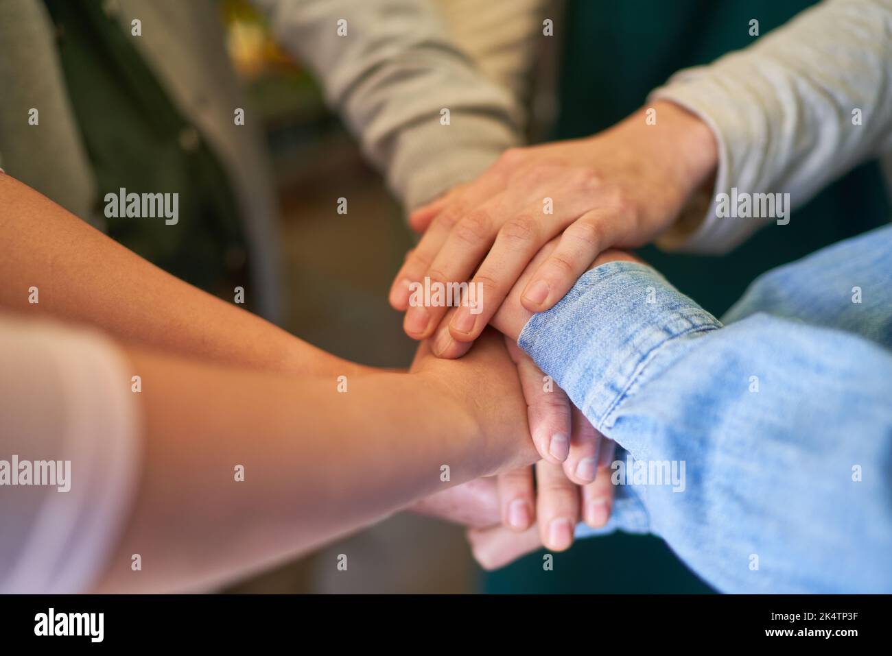 People stack hands as concept for cooperation and team building in ...
