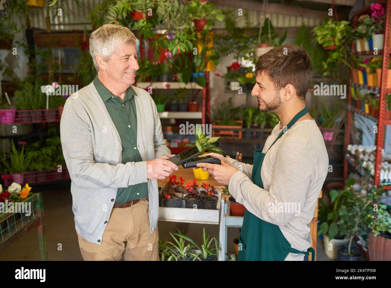 Customer pays contactless with a smartphone app at the NFC card