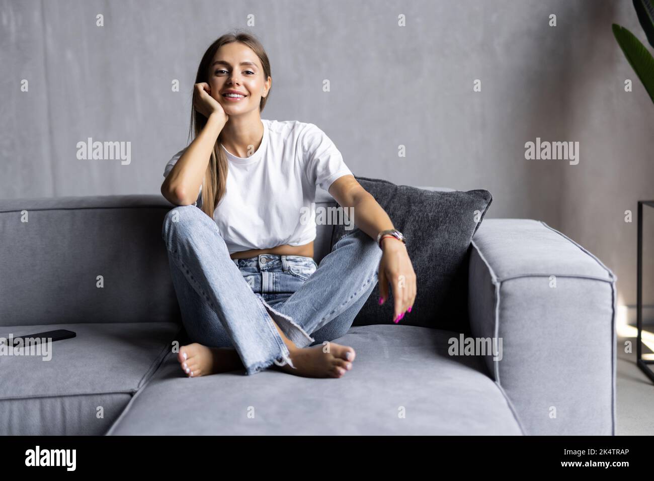 Beauty woman with white perfect smile looking at camera at home Stock Photo