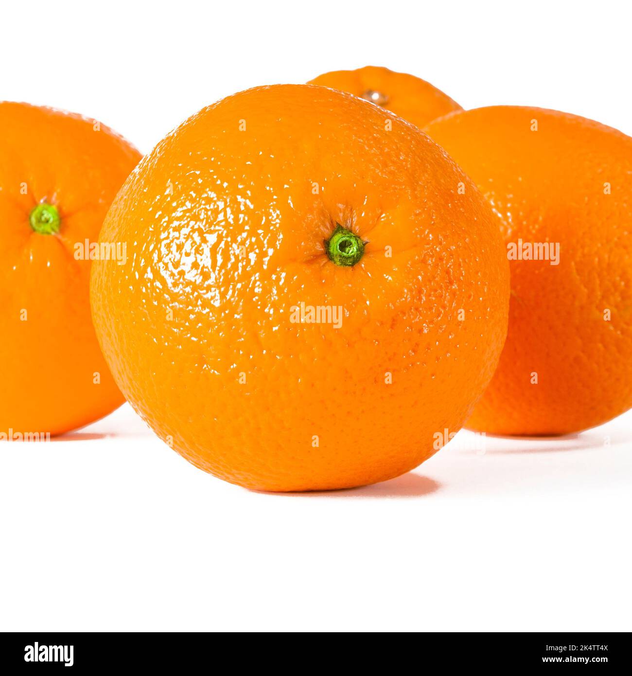 Perfectly Ripe Orange A harvest of ripe juicy oranges lies on a white background Stock Photo ...