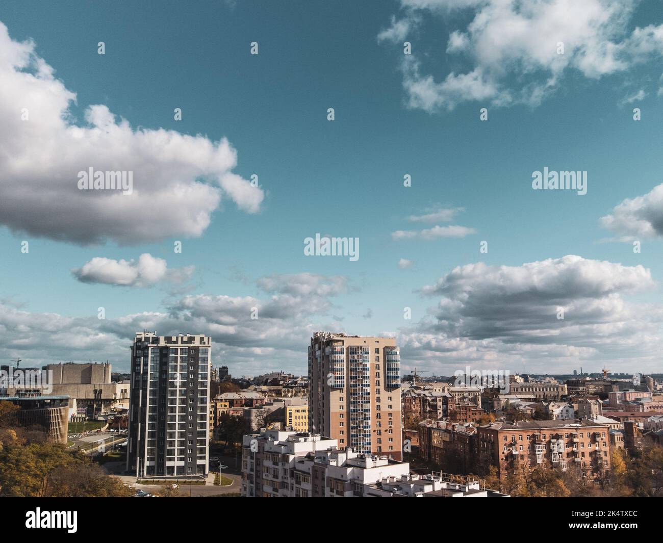 City aerial view, residential buildings in autumn with scenic cloudy blue sky, sunny downtown. Kharkiv, Ukraine Stock Photo