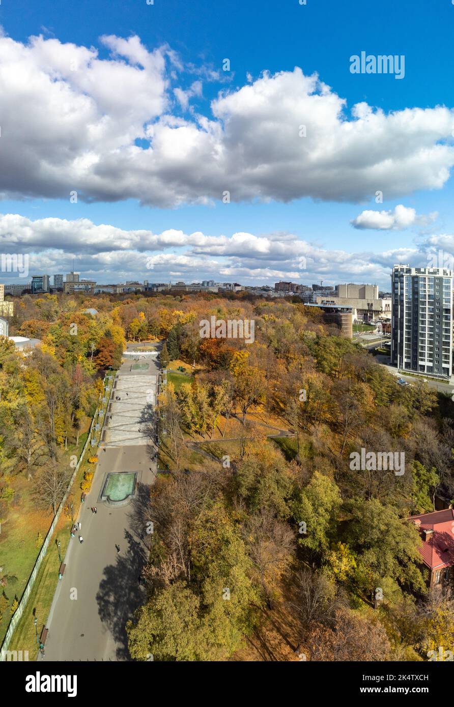 Sunny aerial autumn Cascade stairs with fountain. Tourist attraction in Shevchenko City Garden with modern buildings and scenic sky. City central park Stock Photo