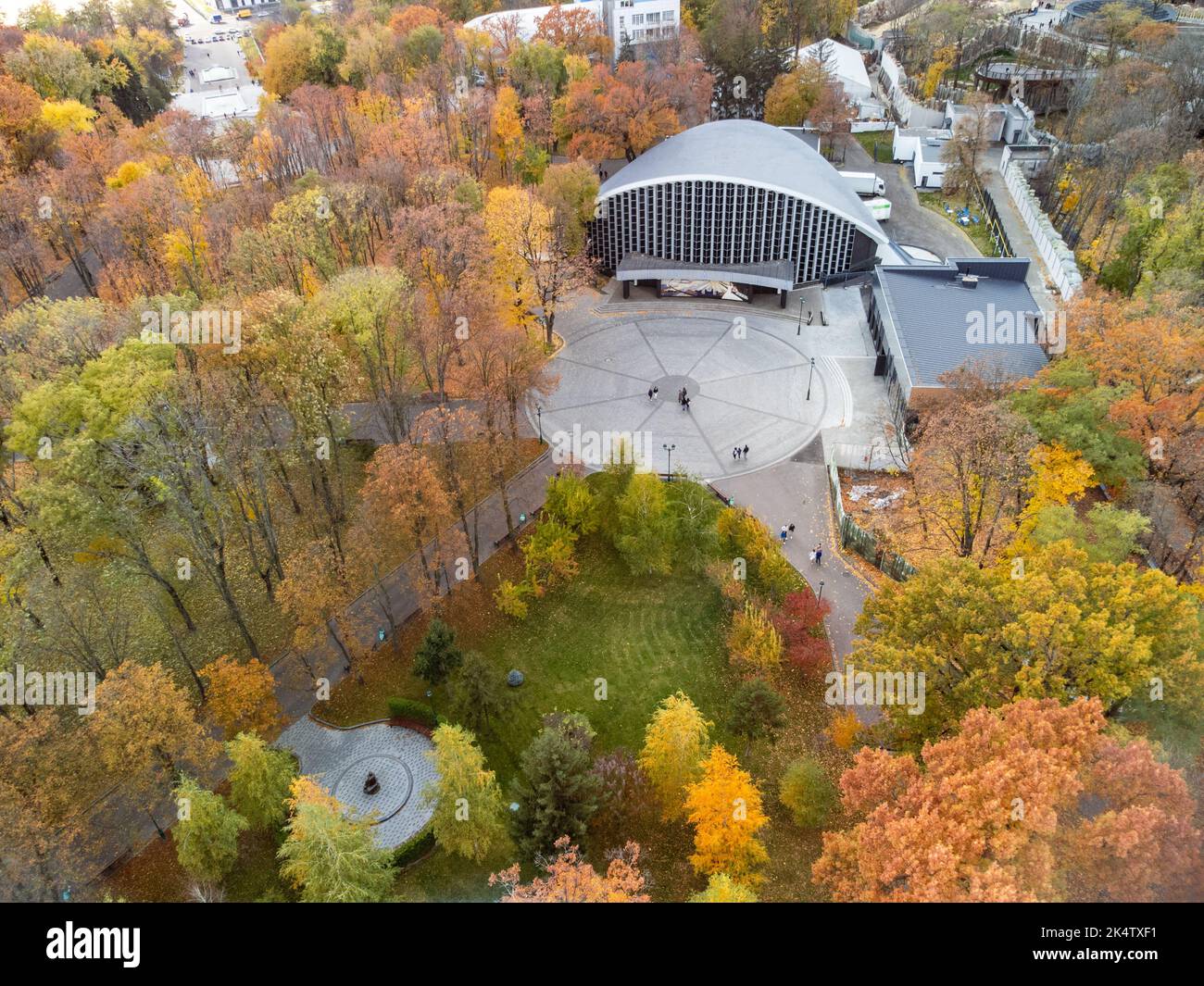 Aerial view on Concert hall Ukraine in vibrant autumn Shevchenko City Garden. Tourist attraction and historical sights in central city park Stock Photo
