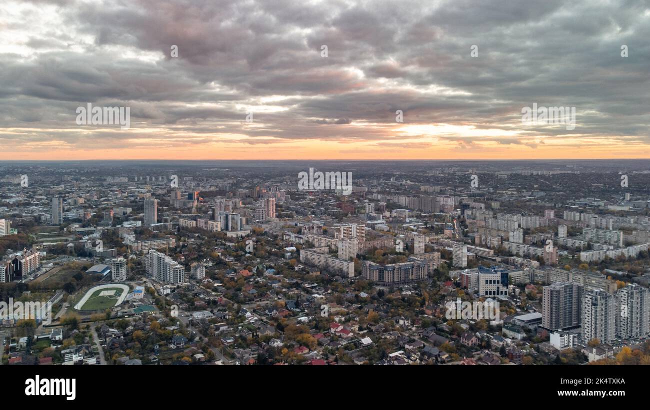 Aerial autumn city panorama view with epic cloudscape. Residential district buildings in evening light. Kharkiv, Ukraine Stock Photo