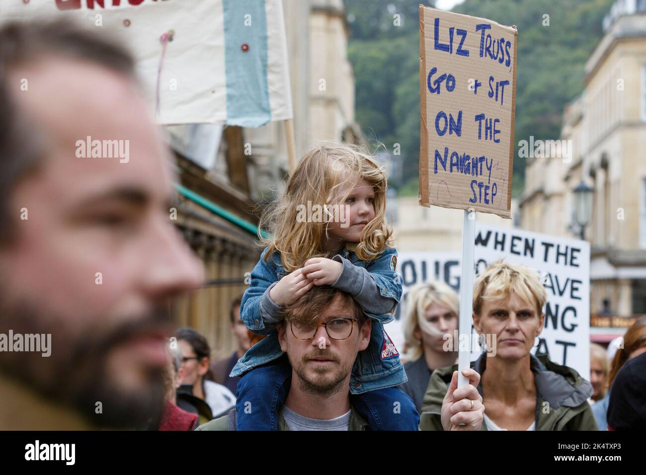 Bath, UK. 1st Oct, 2022. Protesters carrying placards are pictured in Bath taking part in a enough is enough cost of living protest rally and march. Stock Photo