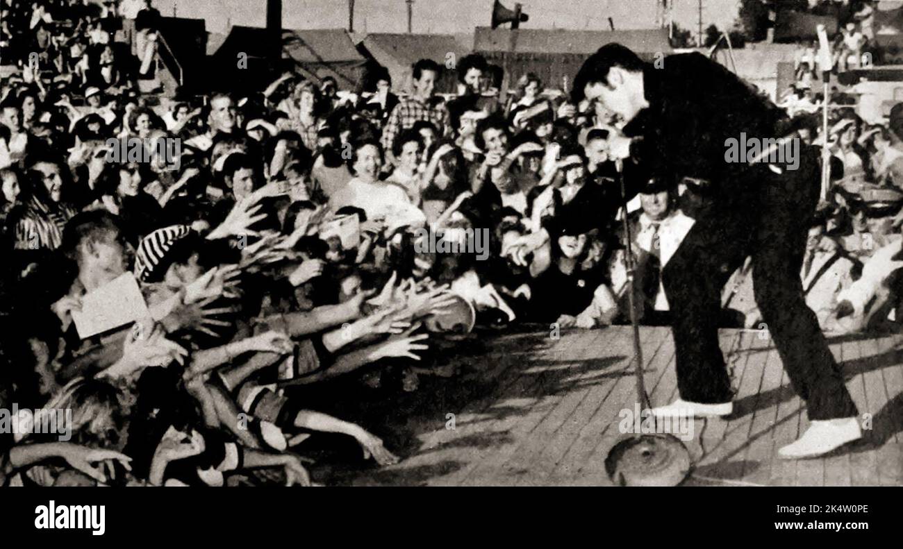 Photo taken from TV Radio Mirror, March 1957 - Elvis performing live at the Mississippi-Alabama Fairgrounds in Tupelo, Mississippi. Stock Photo