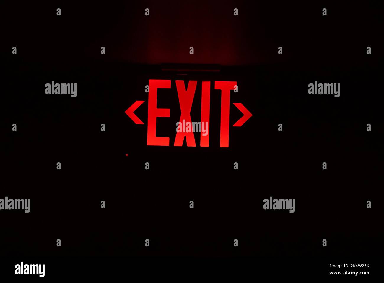 exit red light sign on black background Stock Photo